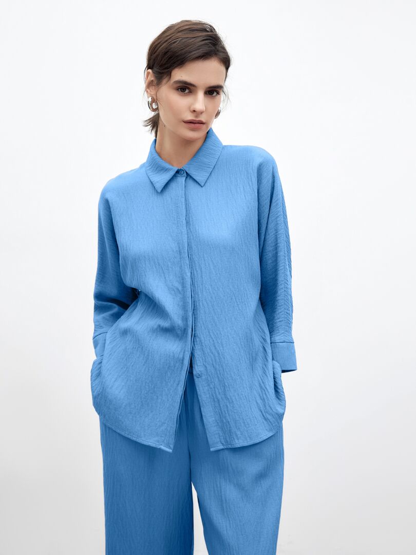 Летняя блуза из фактурной вискозной ткани голубая Pompa